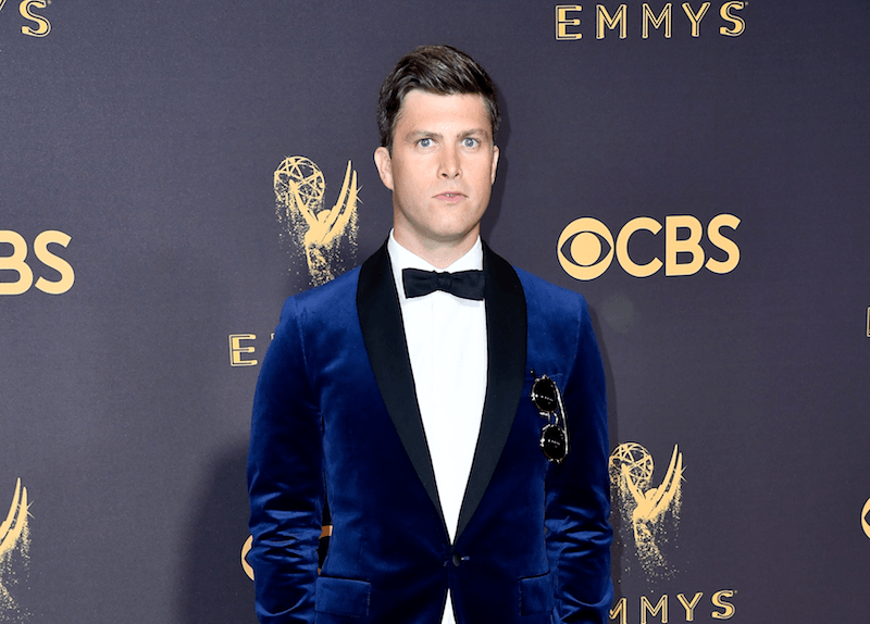 Colin Jost poses in a blue velvet tux at the 2017 Emmys