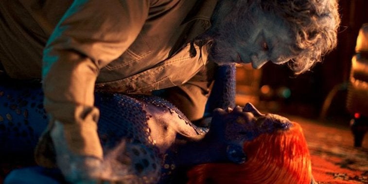 Beast holds himself over Mystique on the ground