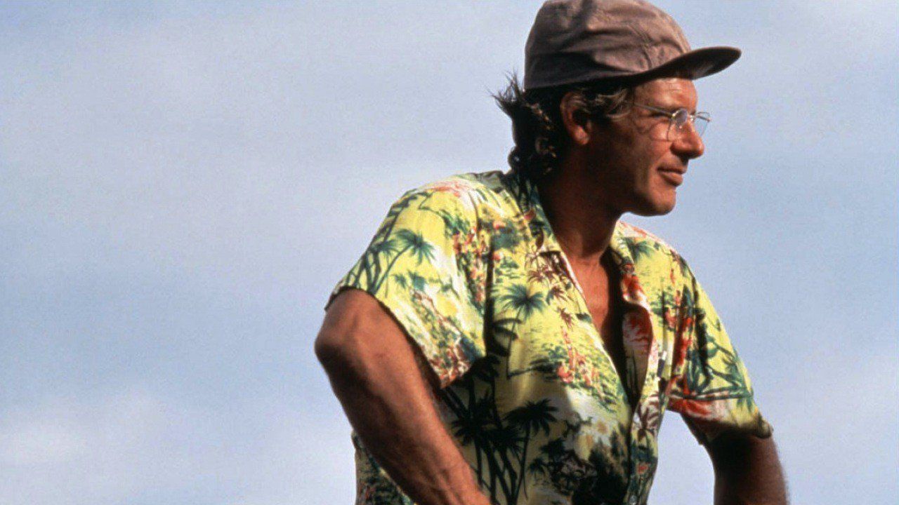 Harrison Ford wears a Hawaiian shirt and a baseball hat as Allie Fox in The Mosquito Coast