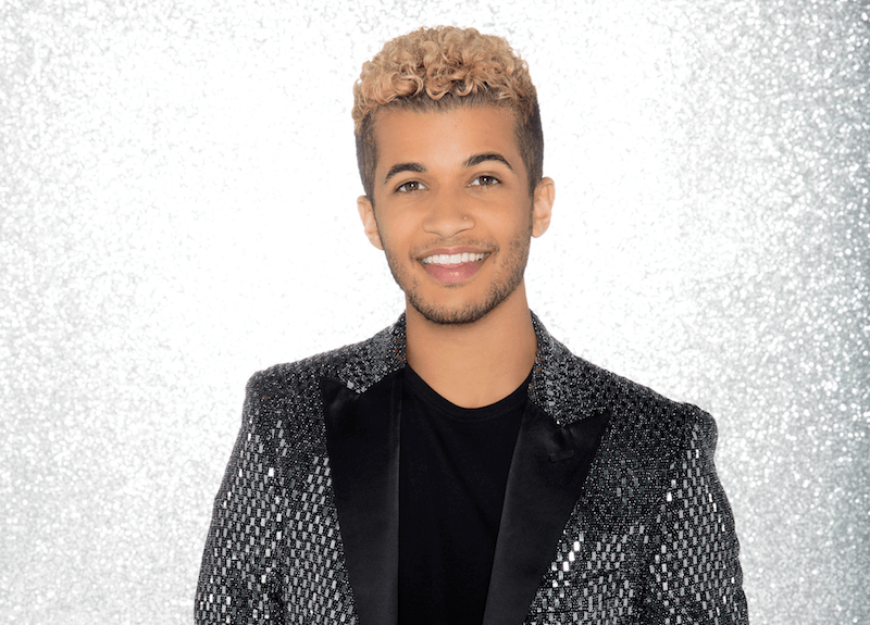 Jordan Fisher poses in a black rhinestone blazer Jordan Fisher poses in a black rhinestone blazer