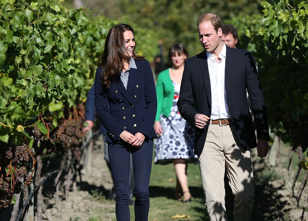 Kate Middleton and Prince William walking through a winery. Kate Middleton and Prince William walking through a winery.