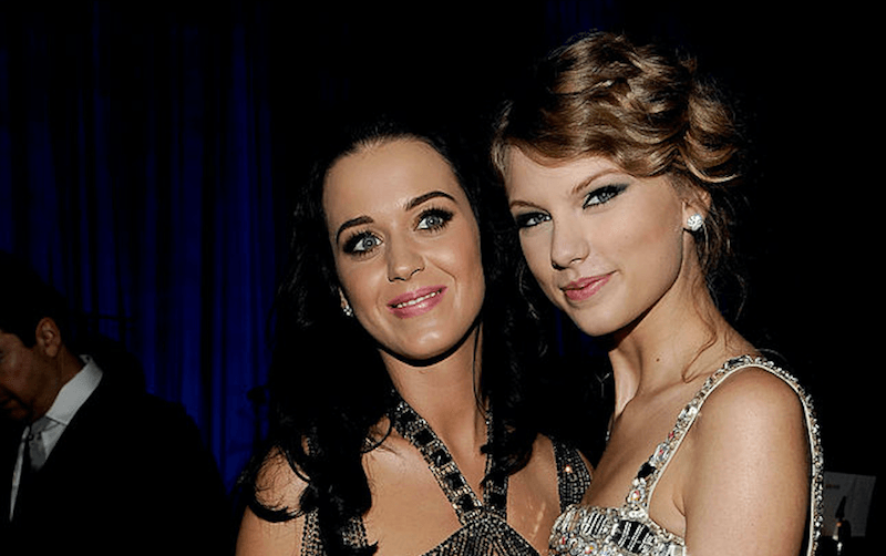 Katy Perry and Taylor Swift posing and smiling together.