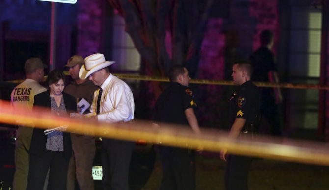 Investigators comb the area outside a home in Plano Texas, where eight people were killed by gunfire on Sunday night. Investigators comb the area outside a home in Plano Texas, where eight people were killed by gunfire on Sunday night.