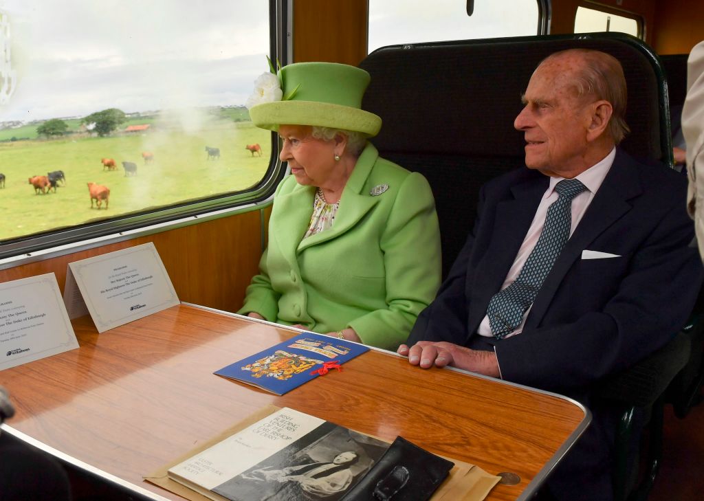 Queen Elizabeth and Prince Phillip on a train. Queen Elizabeth and Prince Phillip on a train.