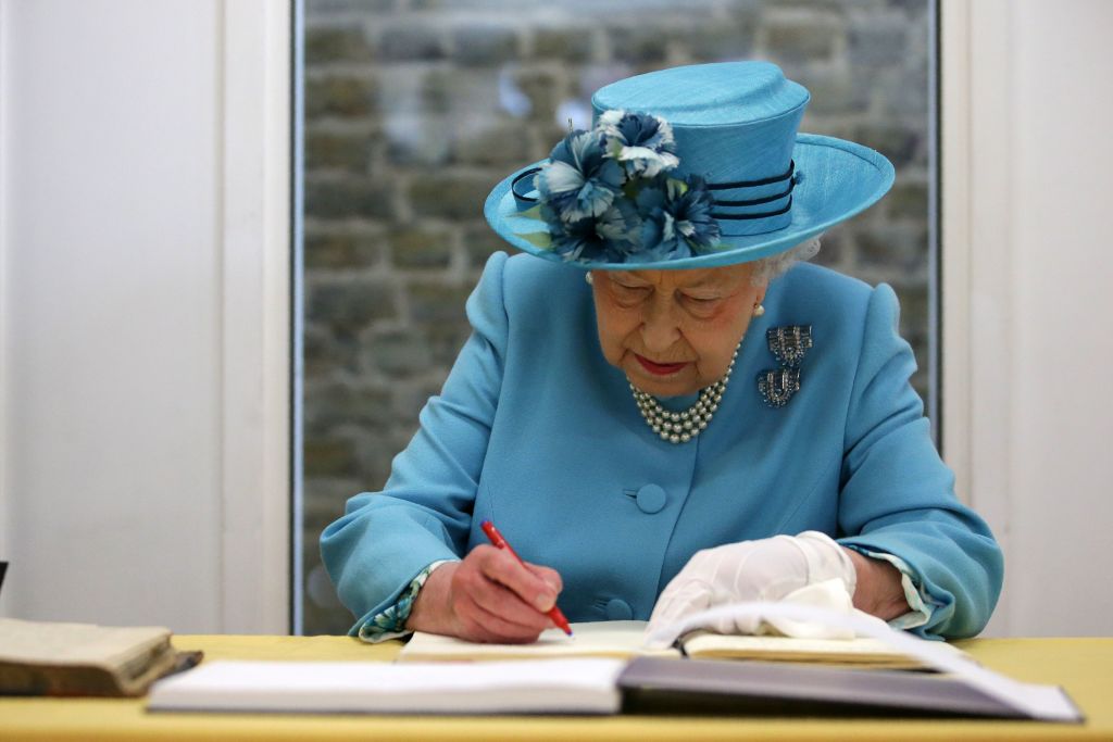 Queen Elizabeth Signing a letter