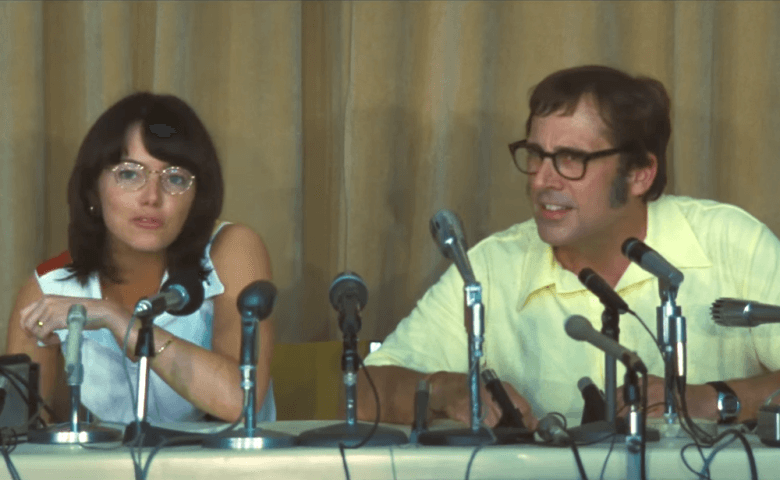 Emma Stone and Steve Carell sit next to each other in front of microphones in Battle of the Sexes Emma Stone and Steve Carell sit next to each other in front of microphones in Battle of the Sexes
