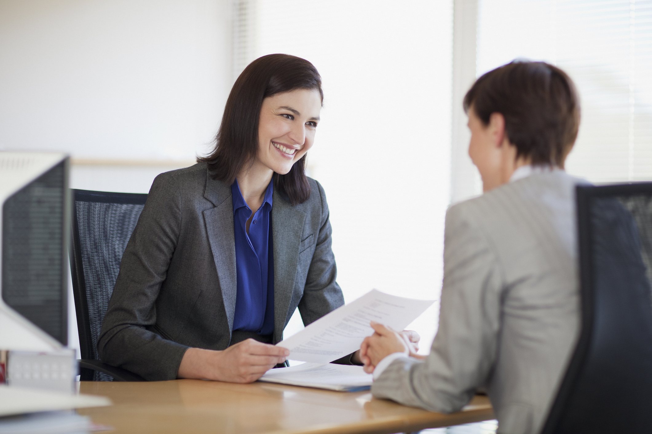 Businesswomen with paperwork on a job interview Job interview
