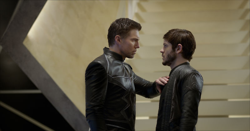 A man places his hand on another man's chest in Inhumans