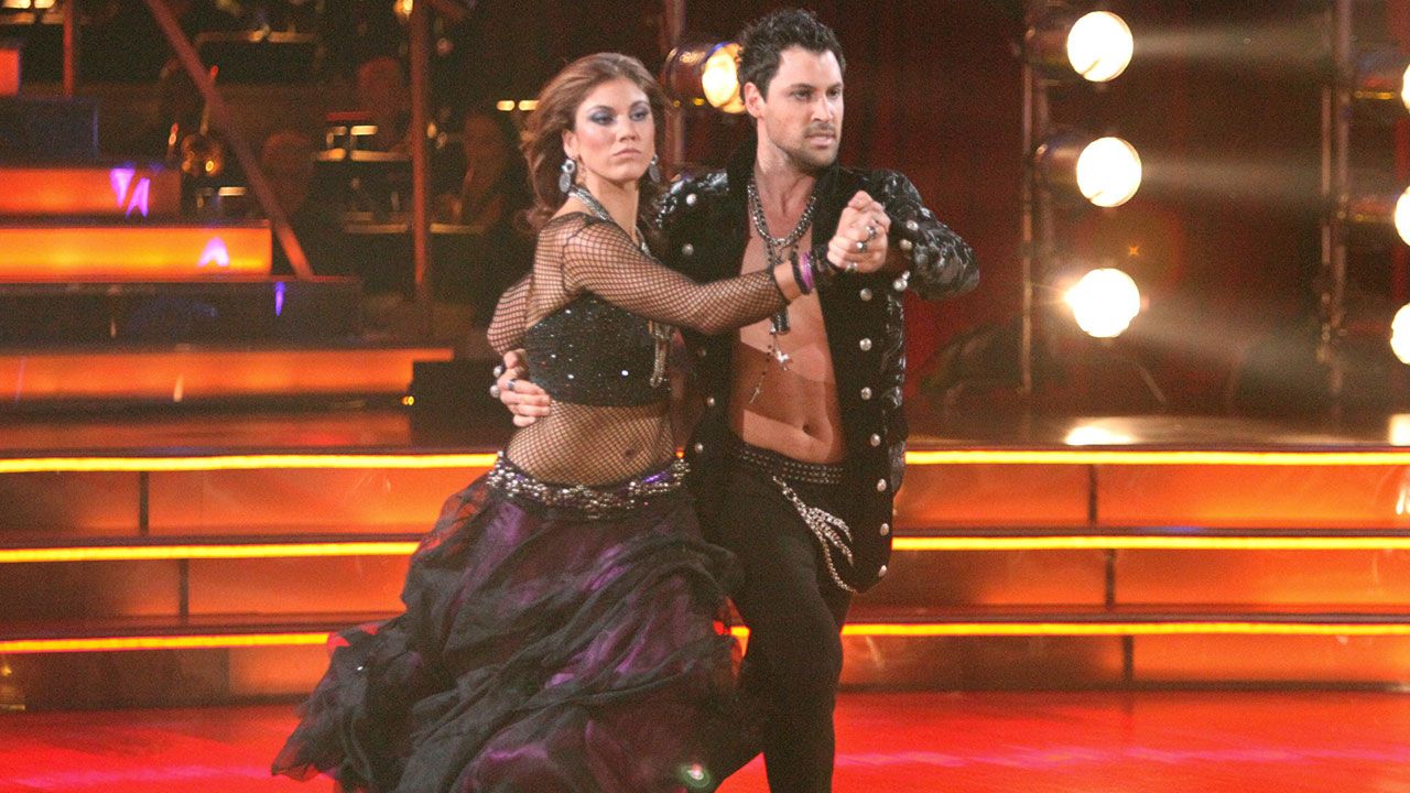 Maksim Chmerkovskiy and Hope Solo hold hands while dancing in black sequin outfits Maksim Chmerkovskiy and Hope Solo hold hands while dancing in black sequin outfits