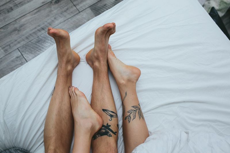 couple of legs in bed couple of legs in bed