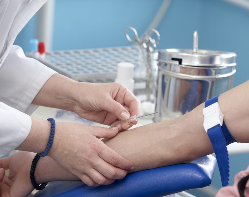 Blood drawn from an old man's arm Blood drawn from an old man's arm