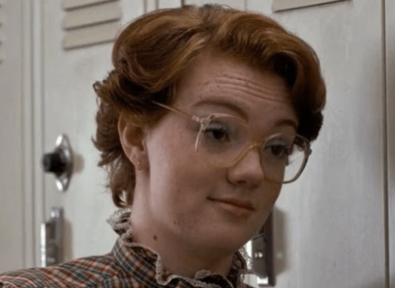 Barb standing in front of a hallways full of lockers. Barb standing in front of a hallways full of lockers.