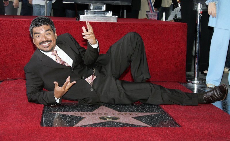 George Lopez smiles as he poses with his star. George Lopez smiles as he poses with his star.