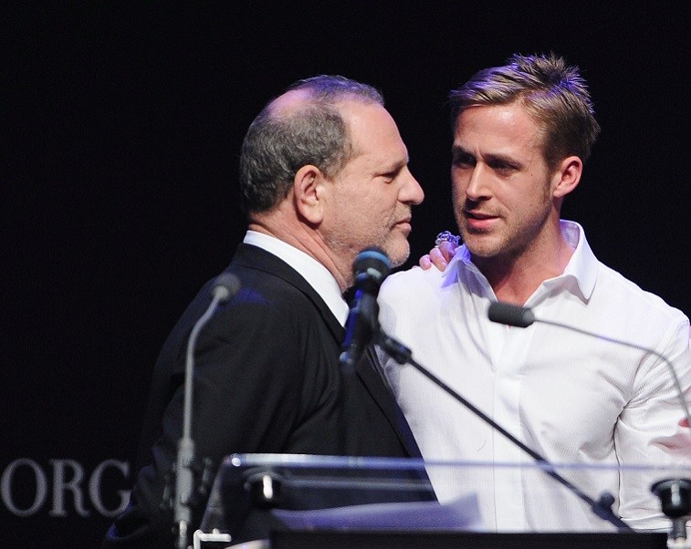 Harvey Weinstein and Ryan Gosling speak during amfAR's Cinema Against AIDS 2010 benefit gala at the Hotel du Cap on May 20, 2010 in Antibes, France.