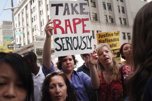 protesters outside a rape trial