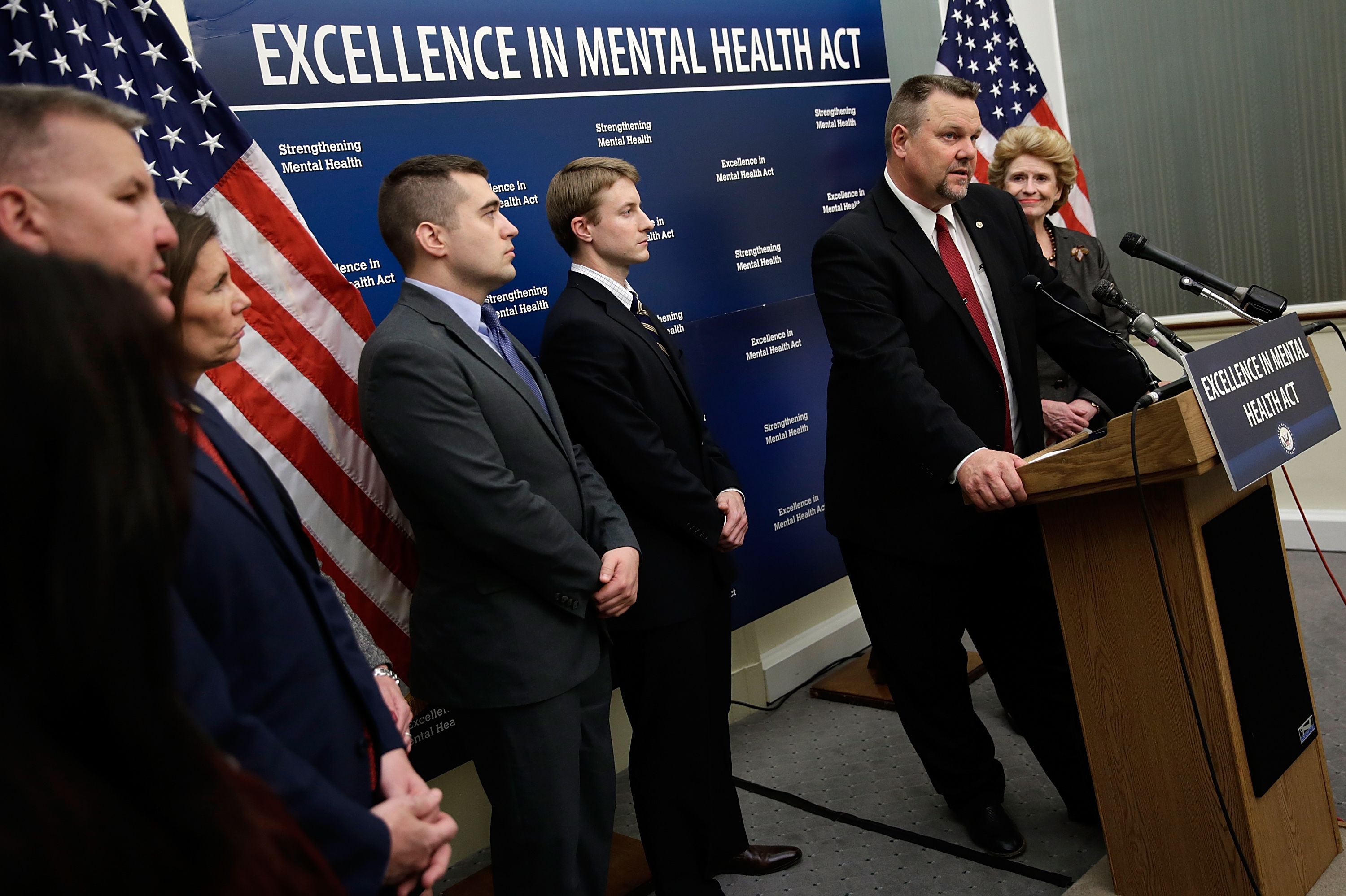 U.S. Sen. Jon Tester (D-MT) (2nd R) speaks during a press conference calling for passage of mental health legislation as part of a gun safety package with U.S. Sen. Debbie Stabenow (D-MI) (R) at the U.S. Capitol