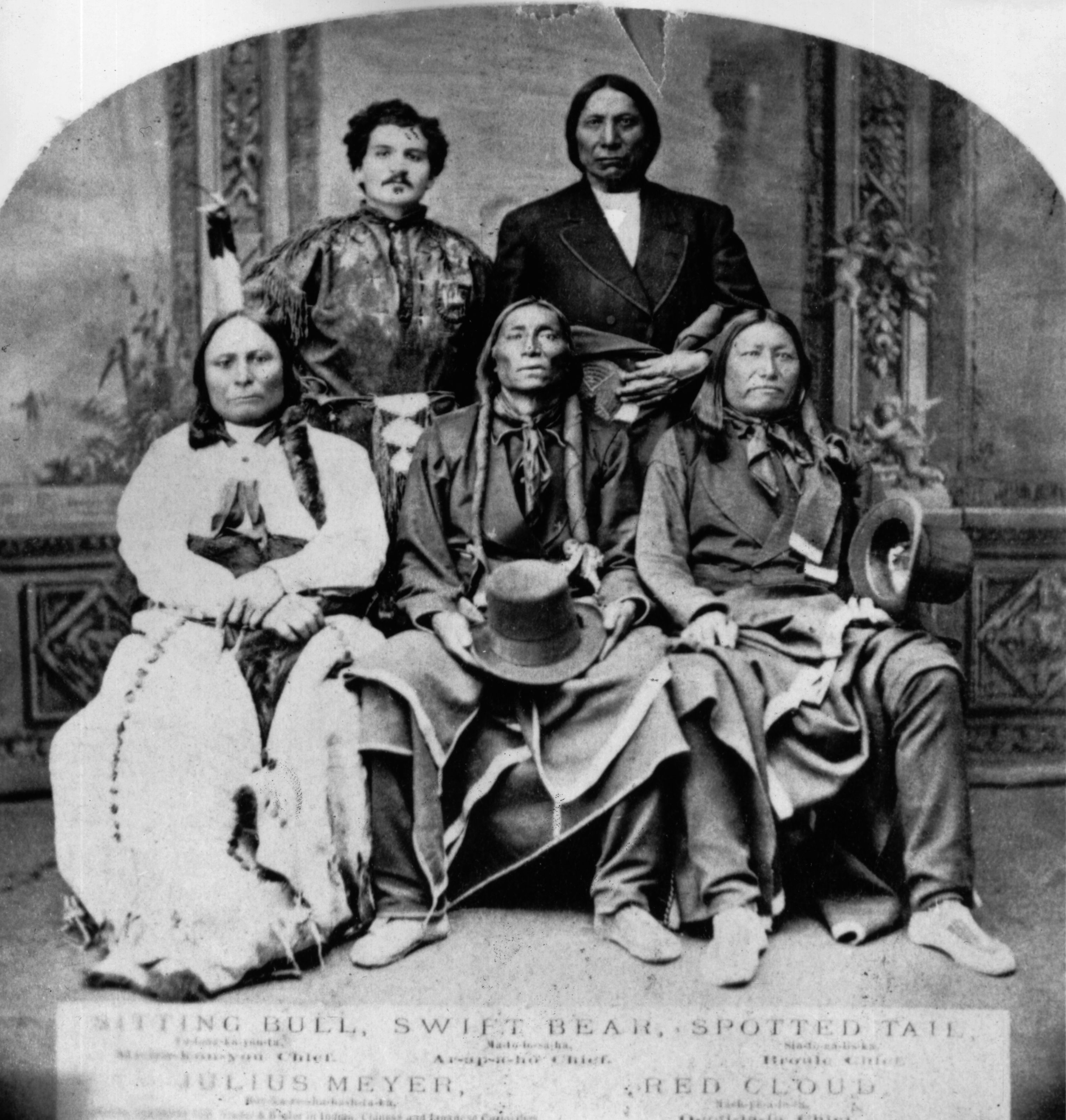 Sitting Bull sits with three other Native Americans and their interpreter Sitting Bull sits with three other Native Americans and their interpreter