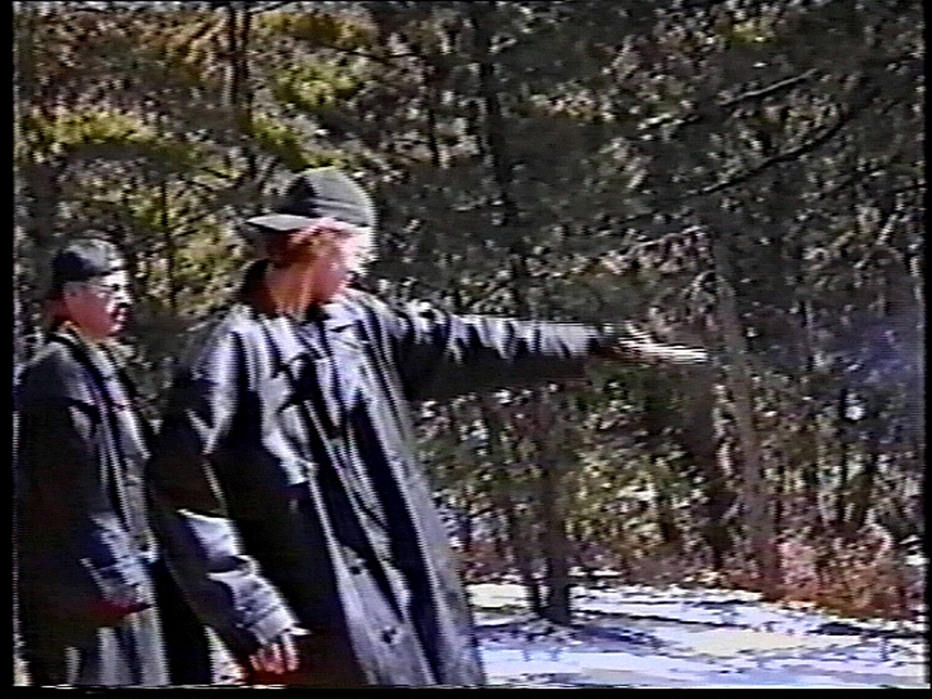 the columbine killers practice at a gun range in black trench coats