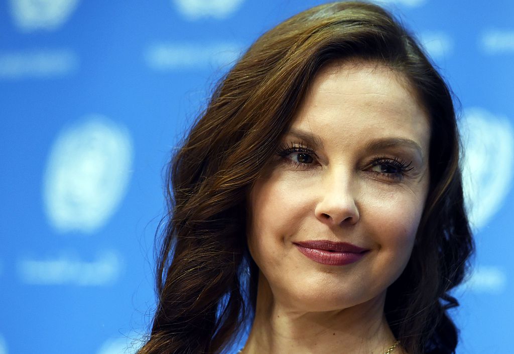 Ashley Judd's face against a blue background.