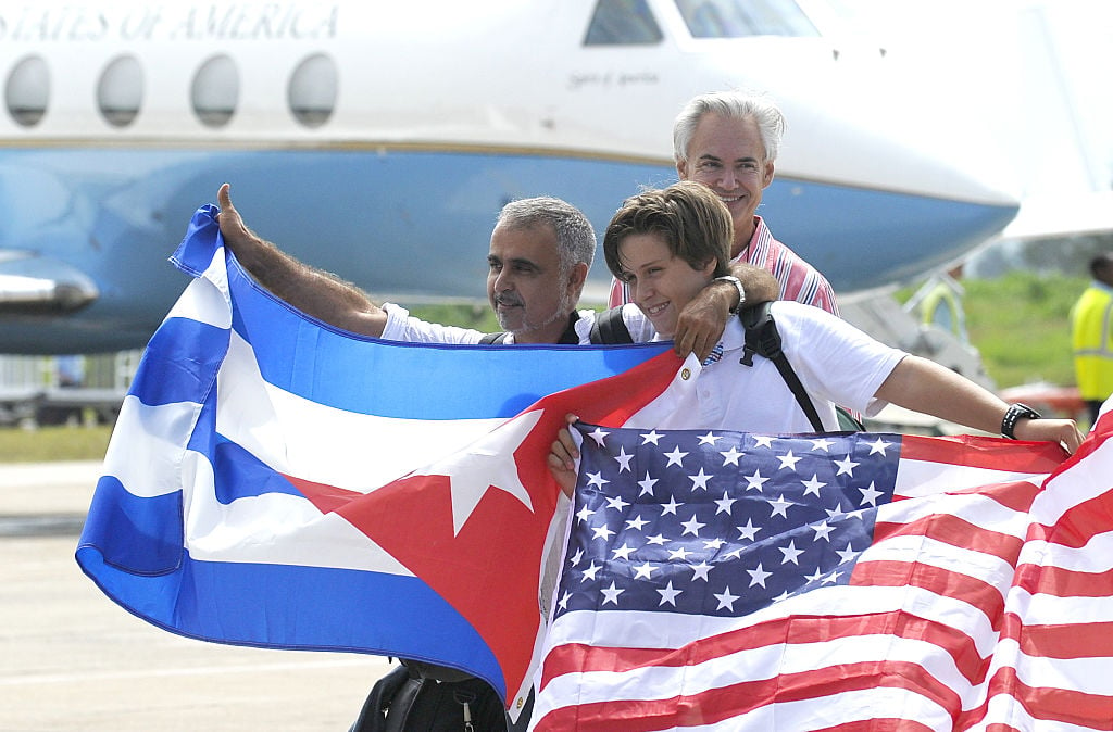 Cuban and American flags and airplane