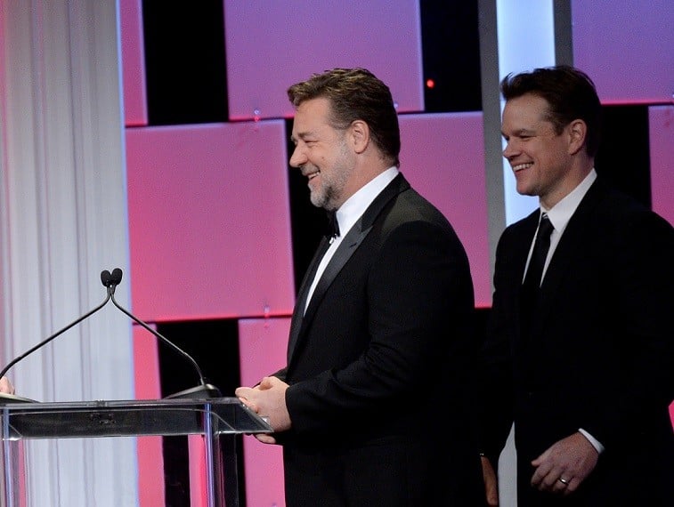 Russell Crowe and Matt Damon walk onstage together in suits Russell Crowe and Matt Damon walk onstage together in suits