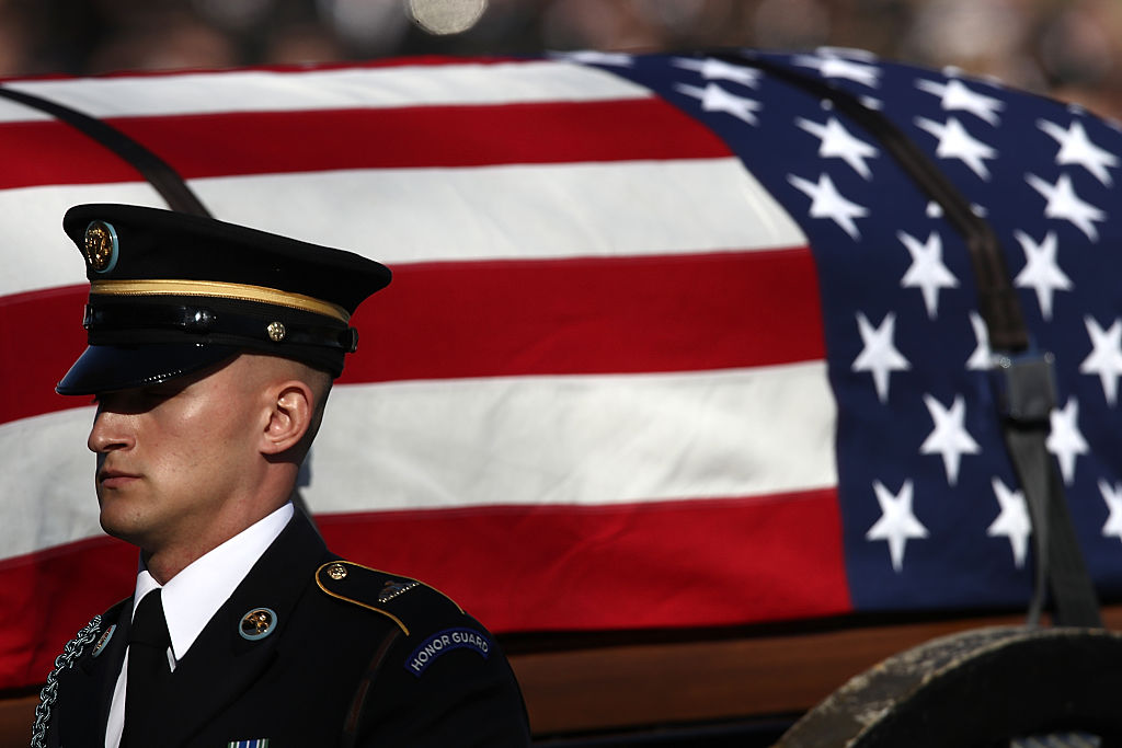 a military casket draped in a flag a military casket draped in a flag