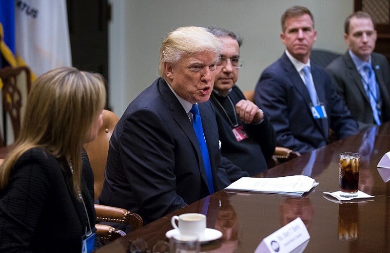 President Donald Trump meets with CEO of General Motors Mary Barra (L), CEO of Fiat Chrysler Automobiles Sergio Marchionne (3rd R) and Fiat Chrysler Head of External Affairs Shane Karr (2nd R) in the Roosevelt Room of the White House on January 24, 2017 in Washington, DC.