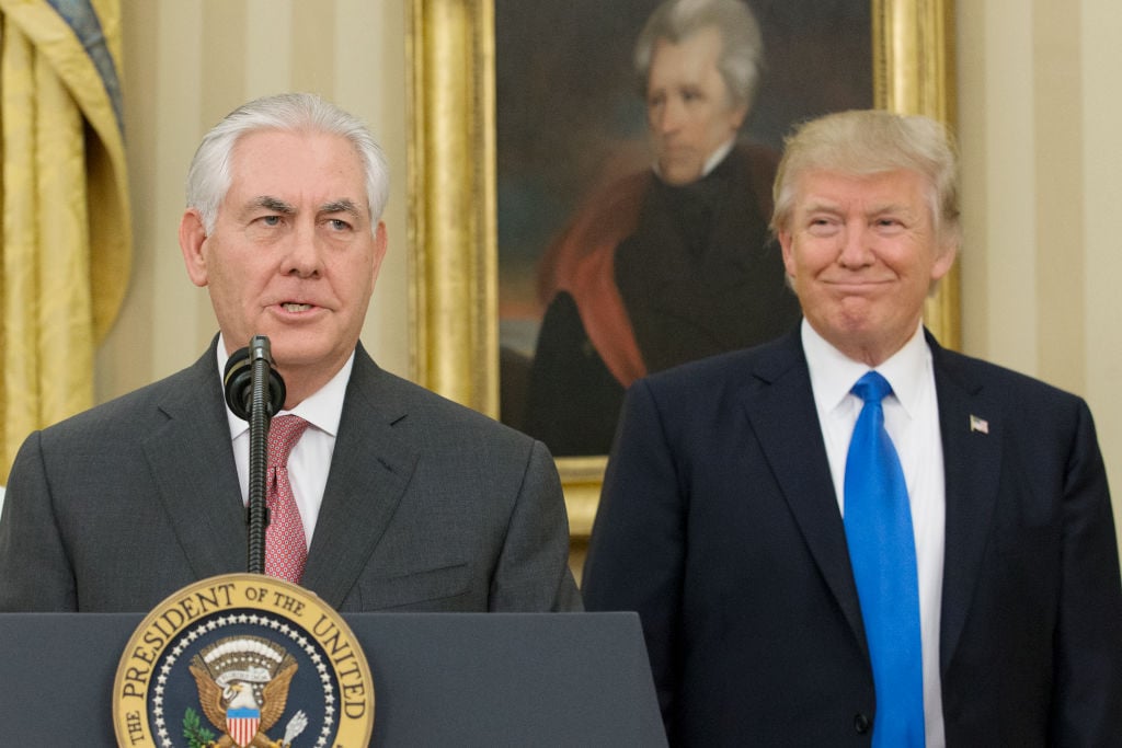 Rex Tillerson delivers remarks after being sworn in as 69th secretary of state as President Donald Trump looks on beneath a painting of populist President Andrew Jackson in the Oval Office of the White House.