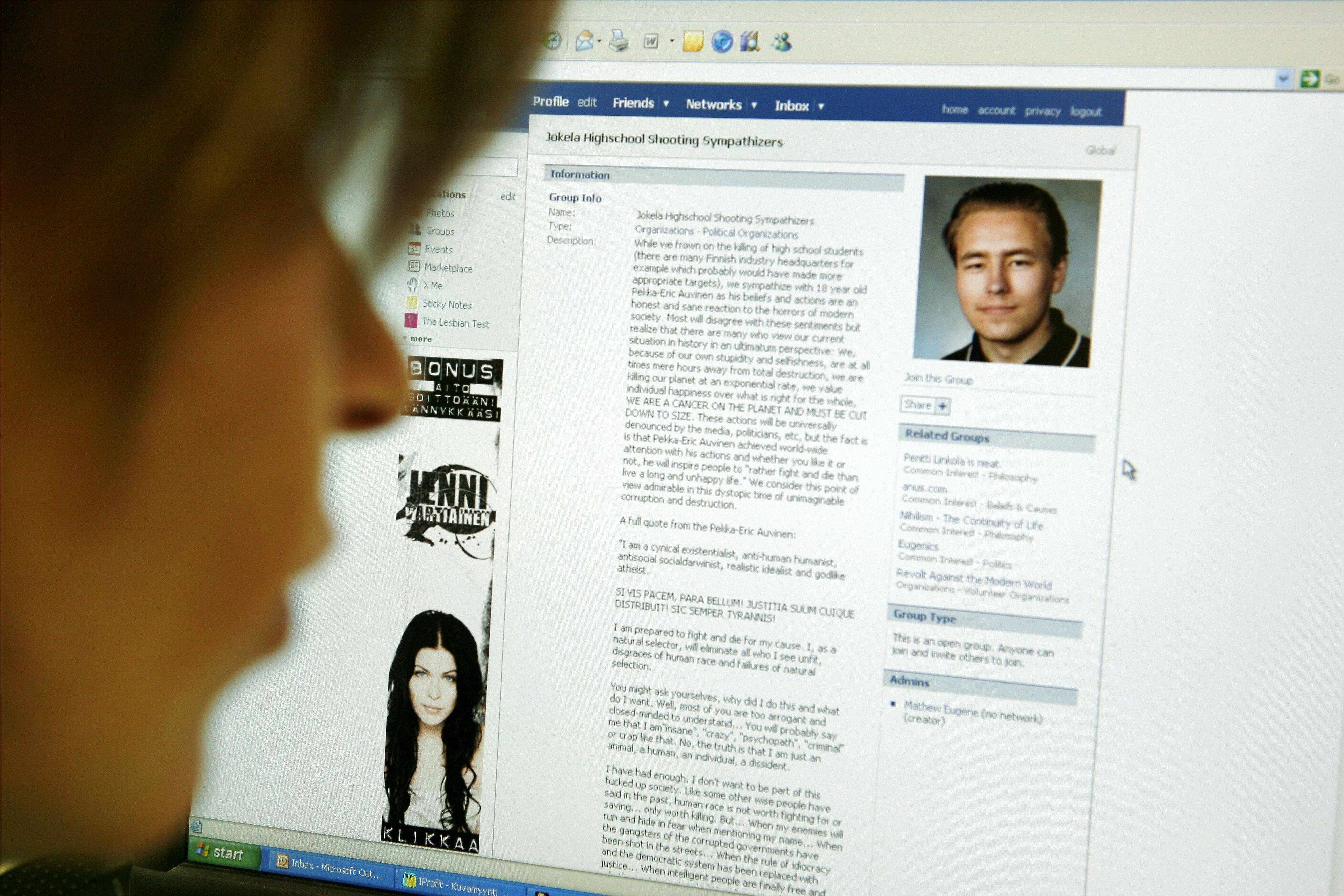 A woman looks at an internet webpage of the "Jokela Highschool Shooting Sympathizers' portraying a picture of Finnish high school student Pekka-Eric Auvinen A woman looks at an internet webpage of the "Jokela Highschool Shooting Sympathizers' portraying a picture of Finnish high school student Pekka-Eric Auvinen