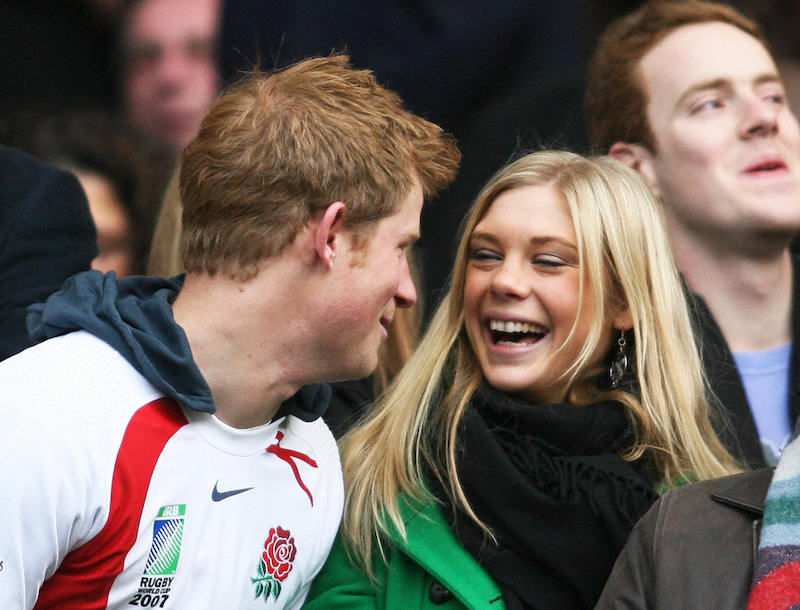 Britain's Prince Harry and Chelsy Davy laugh before the game between South Africa and England at the Investec Challenge international rugby match at Twickenham,