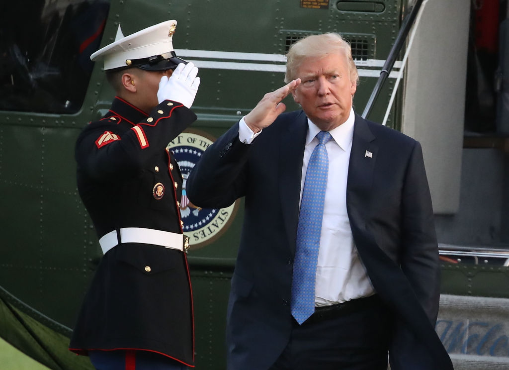 Trump saluting with an air force member