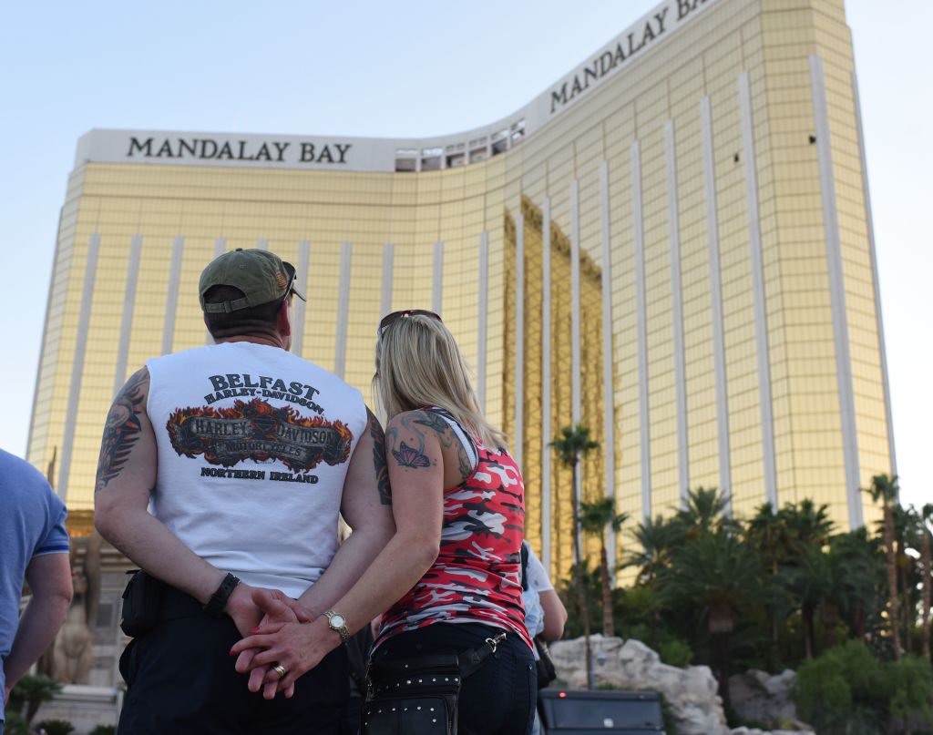 a couple standing in front of mandalay bay hotel a couple standing in front of mandalay bay hotel