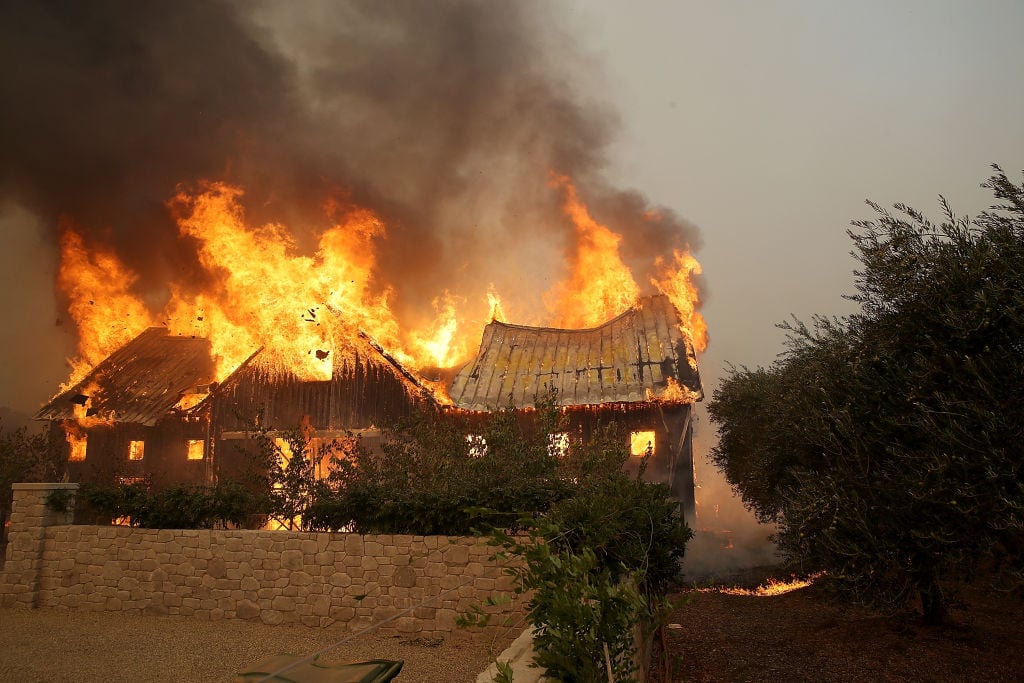 a brown house goes up in flames