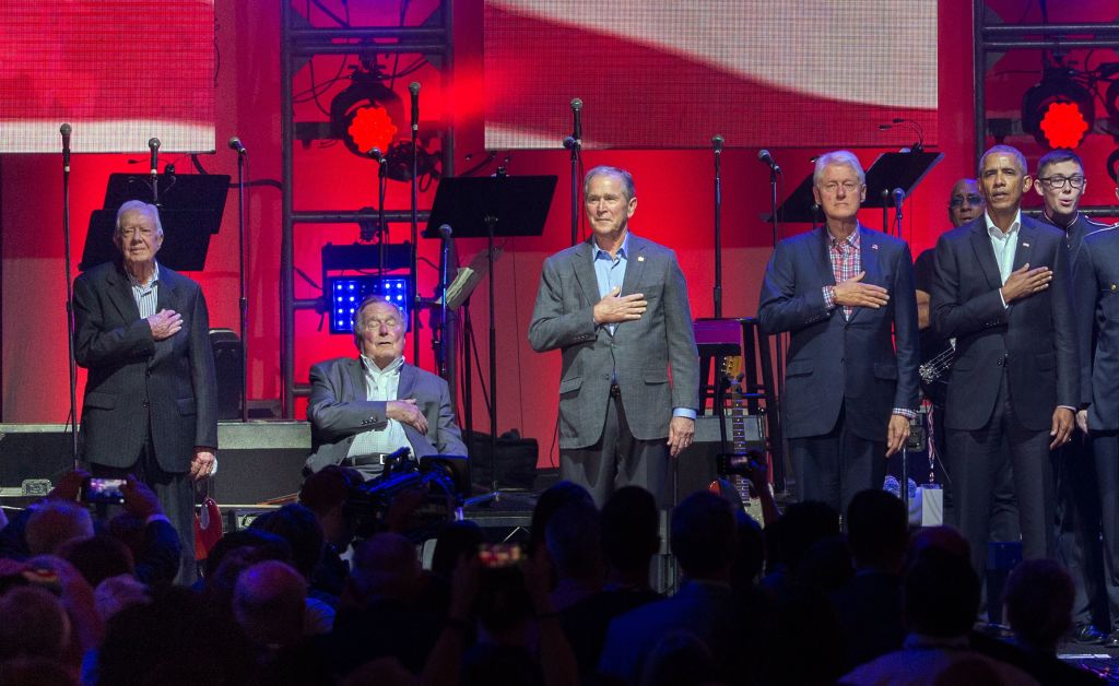 five former presidents with their hands on their hearts, with red, white and blue background five former presidents with their hands on their hearts, with red, white and blue background