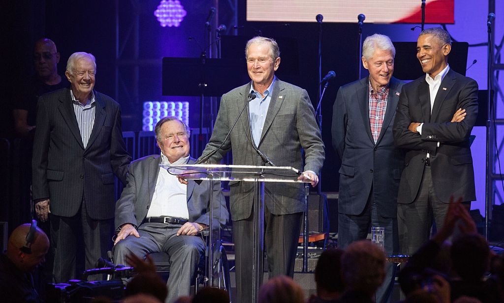 George W. Bush speaks as other former presidents look on during benefit concert George W. Bush speaks as other former presidents look on during benefit concert