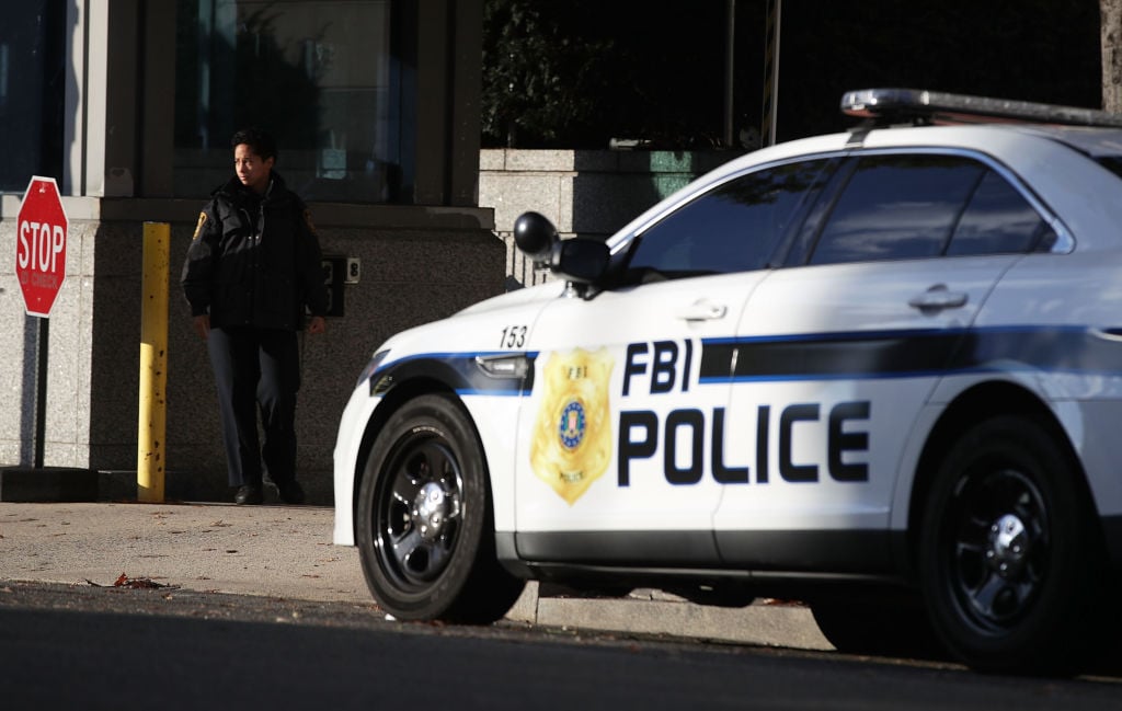 an FBI police car and guard an FBI police car and guard