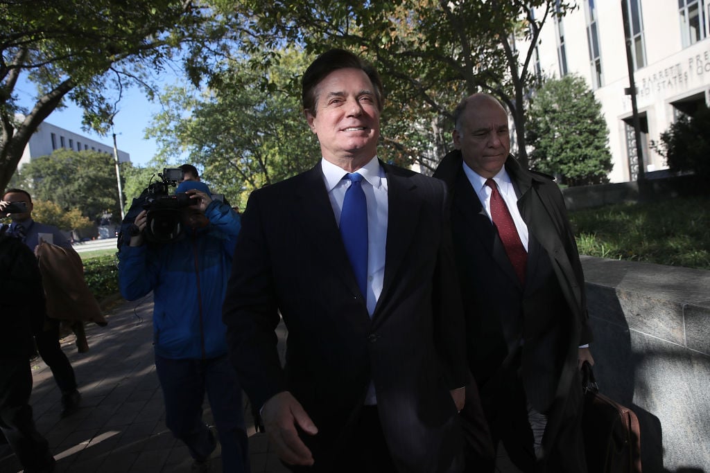 paul manafort in a dark suit and blue tie leaves his indictment paul manafort in a dark suit and blue tie leaves his indictment