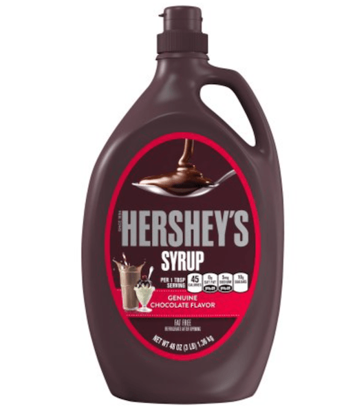 Hershey Syrup bottle behind a white background. Hershey Syrup bottle behind a white background.
