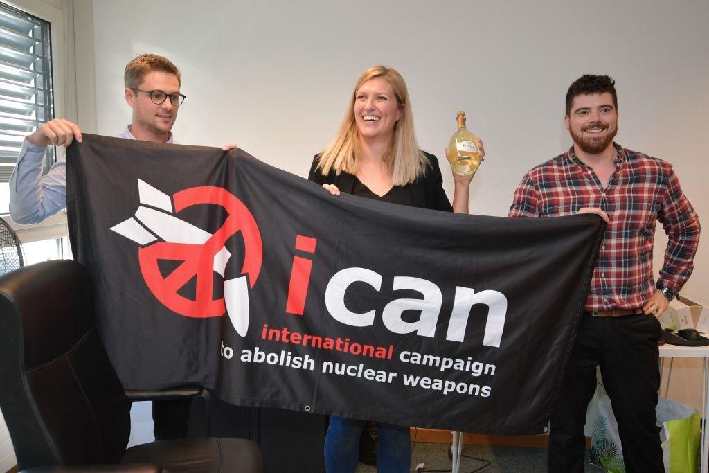 ICAN members after winning Nobel Peace Prize ICAN members pose with banner