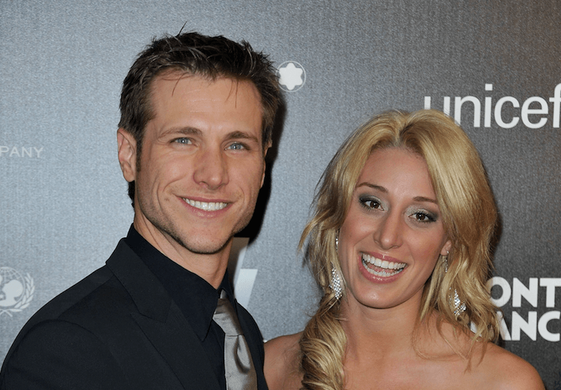 Jake Pavelka and Vienna Girardi smiling as they stand next to each other while posing for the paparazzi. Jake Pavelka and Vienna Girardi smiling as they stand next to each other while posing for the paparazzi.