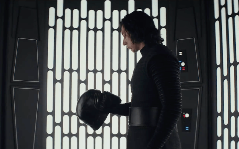 Kylo Ren holding his helmet. Kylo Ren holding his helmet.