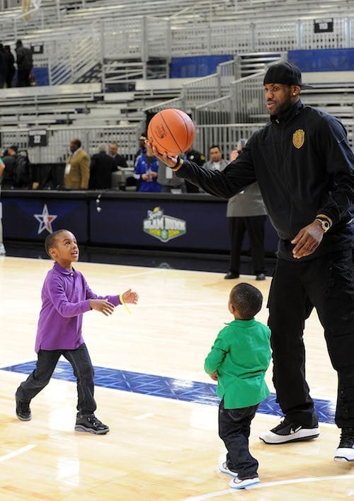 LeBron James playing basketball with two of his sons. LeBron James playing basketball with two of his sons.