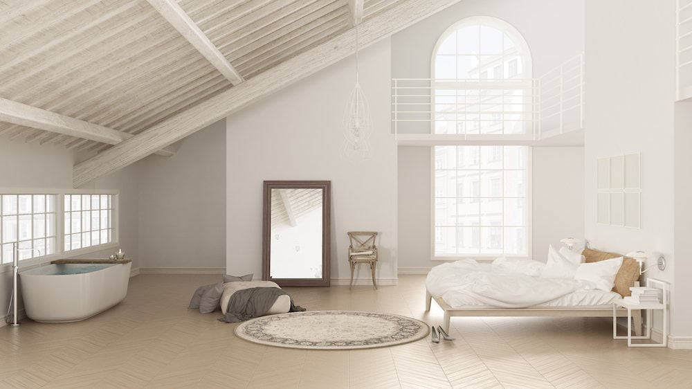 Loft bedroom with a large mirror