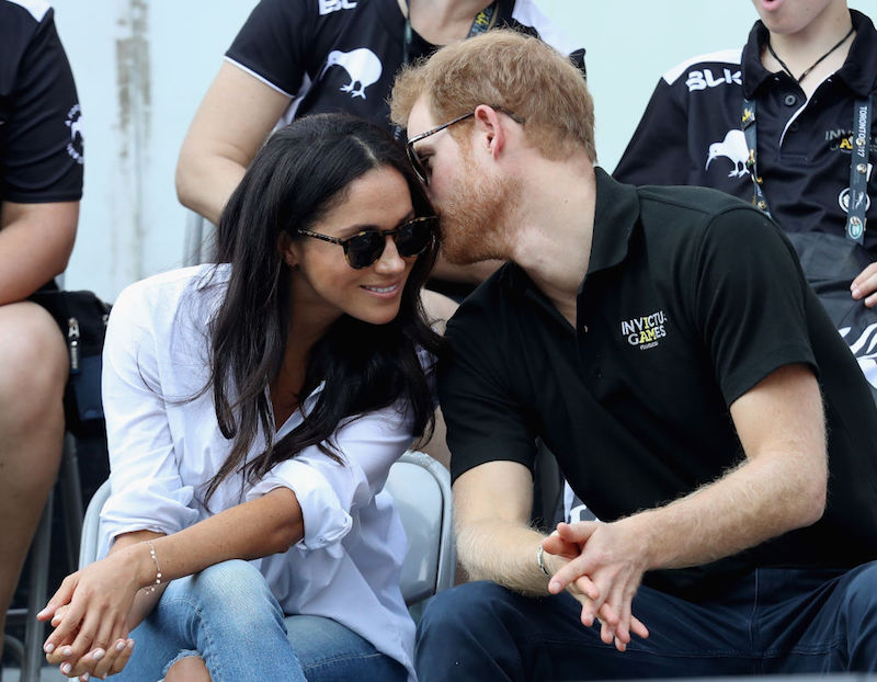 Prince Harry (R) and Meghan Markle (L) attend a Wheelchair Tennis match during the Invictus Games 2017 at Nathan Philips Square on September 25, 2017 in Toronto, Canada