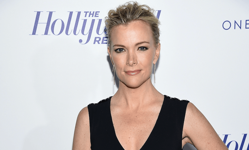 Megyn Kelley posing in a black dress. Megyn Kelley posing in a black dress.