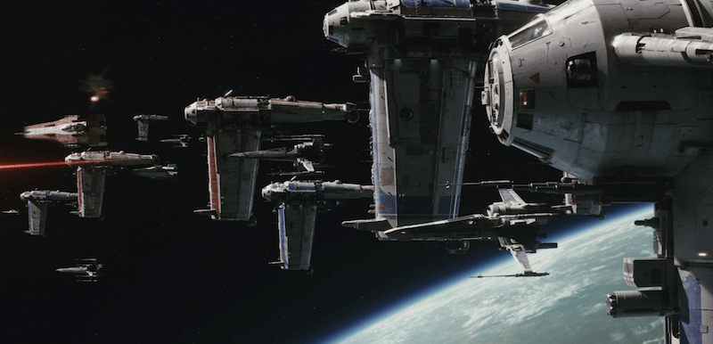 Space ships seen cruising past a planet in space. Space ships seen cruising past a planet in space.