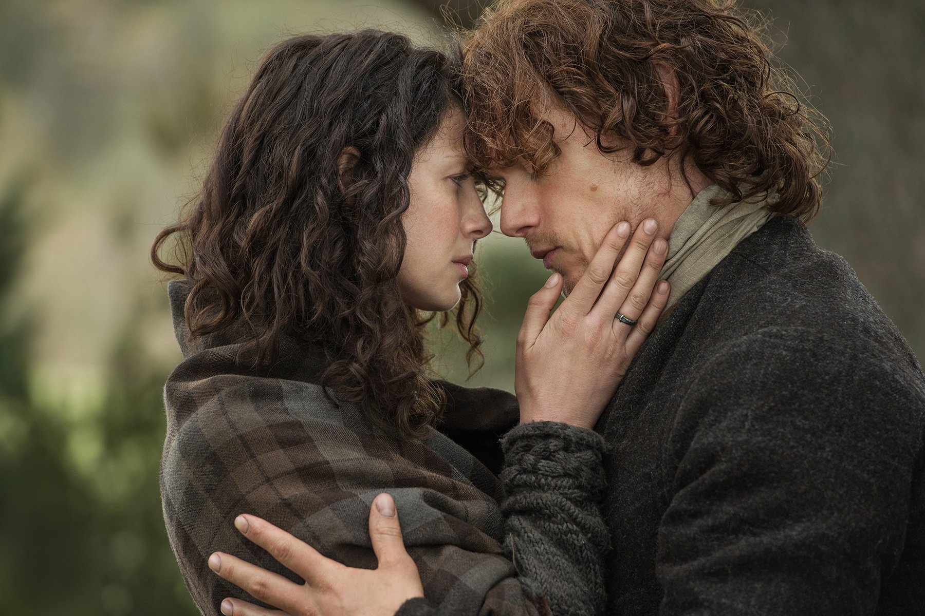 Jamie and Claire embrace on Outlander 