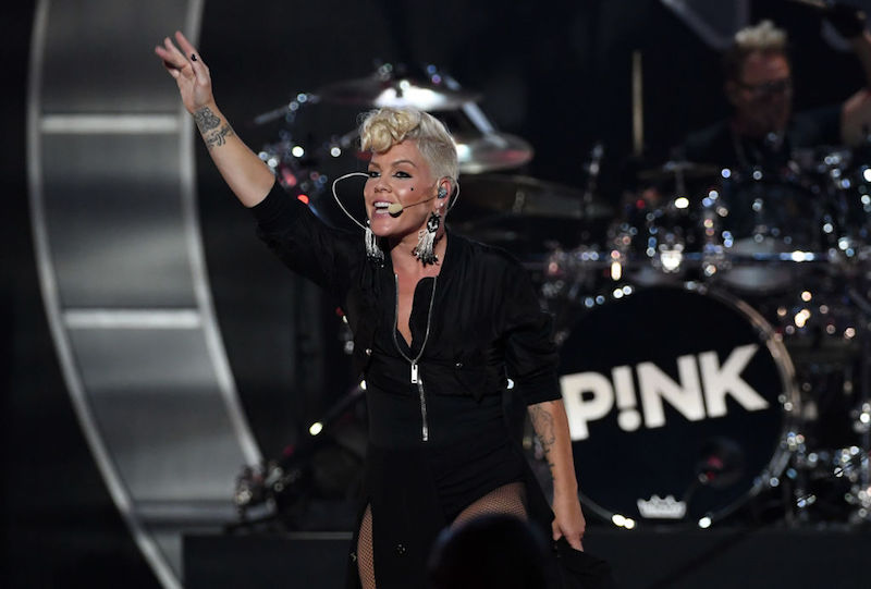 Pink waving at fans during a concert. Pink waving at fans during a concert.