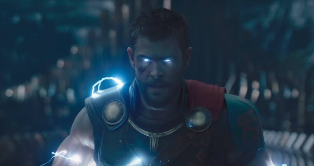 Thor with electricity flowing over his body and illuminating his eyes.