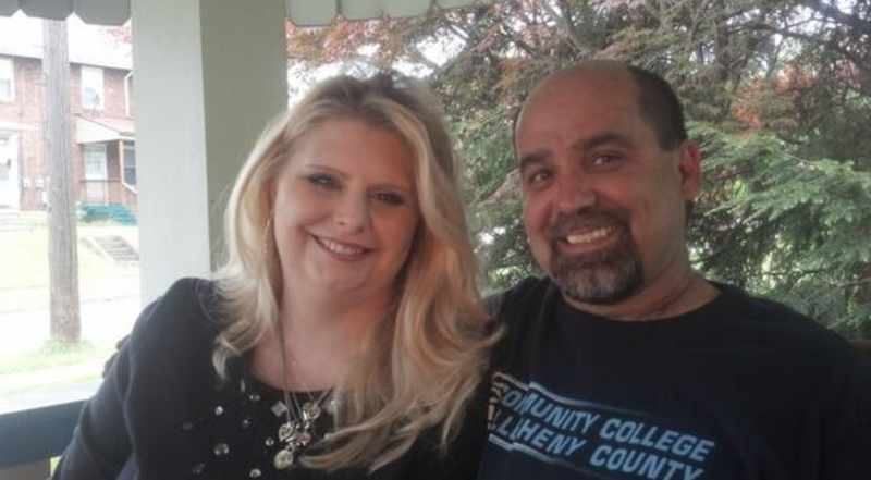 couple sits together on a porch couple sits together on a porch